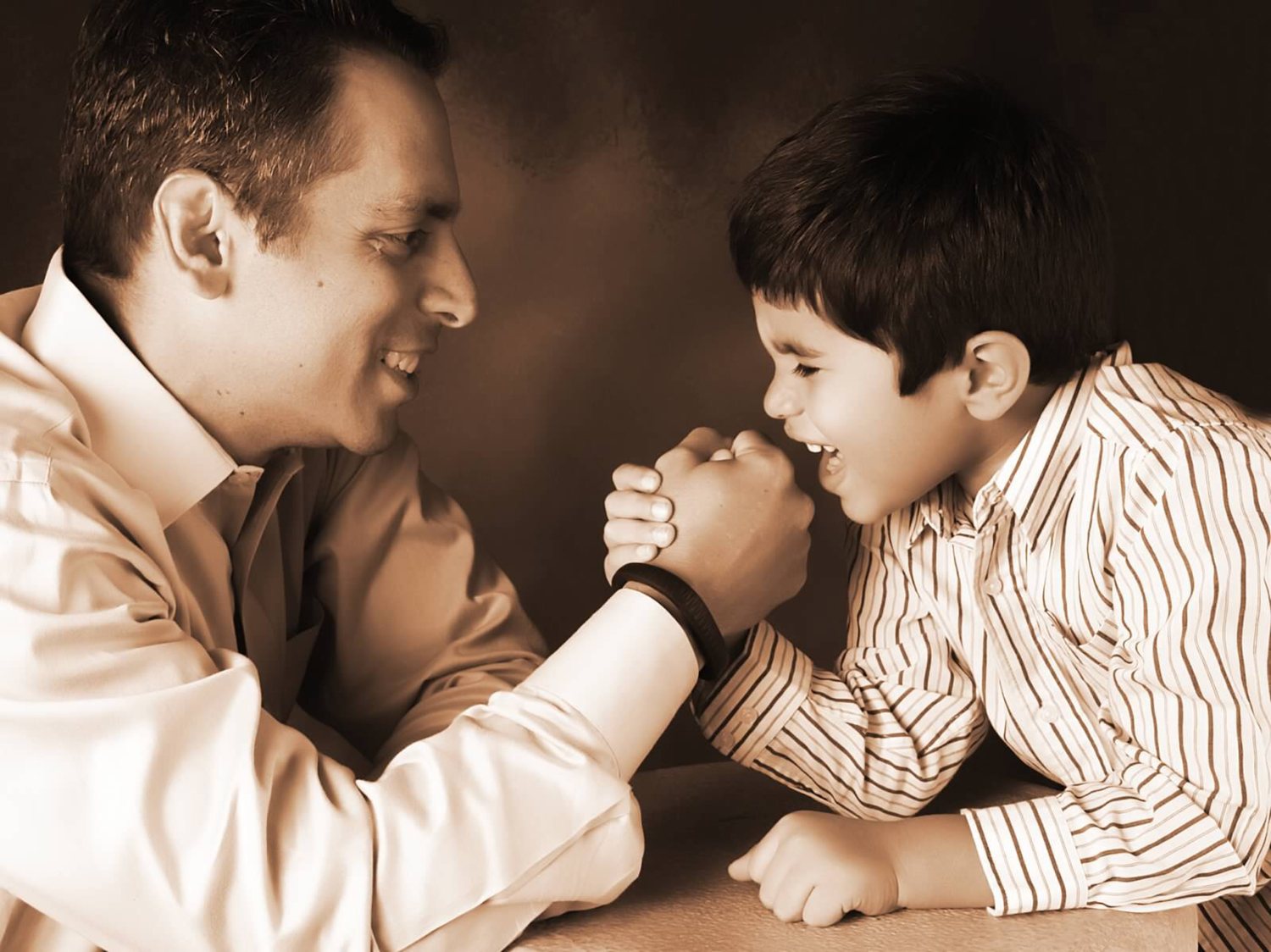 Father and son arm wrestling portrait South Florida